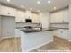 Bright new kitchen featuring white cabinets, dark counter tops, and stainless steel appliances at 11455 Prosperity Church Rd, Huntersville, NC 28078