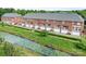Aerial view of townhomes backing onto a creek at 119 Steinbeck Way # E, Mooresville, NC 28117