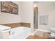 Bathroom featuring separate tub and shower with tile accents and modern fixtures at 119 Steinbeck Way # E, Mooresville, NC 28117