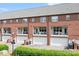 Townhome exterior featuring well-maintained brick facade, garages, and balconies at 119 Steinbeck Way # E, Mooresville, NC 28117