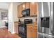 Well-equipped kitchen featuring stainless steel refrigerator and a black oven at 119 Steinbeck Way # E, Mooresville, NC 28117
