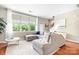 Stylish living room with hardwood floors, a large sectional, and a bright airy feel at 119 Steinbeck Way # E, Mooresville, NC 28117