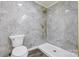 Bathroom featuring a tiled shower, marble accent wall, toilet and new fixtures at 1423 Ebinport Rd, Rock Hill, SC 29732