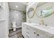 Bright bathroom featuring a double vanity with gold fixtures and a marble-tiled shower with gold shower head at 1423 Ebinport Rd, Rock Hill, SC 29732
