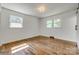 An empty bedroom boasts hardwood floors and lots of natural light at 1423 Ebinport Rd, Rock Hill, SC 29732