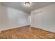 Bedroom featuring hardwood floors, neutral walls, closet, and abundant natural light from the windows at 1423 Ebinport Rd, Rock Hill, SC 29732