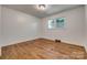 Bedroom featuring hardwood floors, neutral walls, and abundant natural light from the windows at 1423 Ebinport Rd, Rock Hill, SC 29732