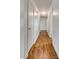 Hallway with hardwood floors, white walls, and multiple white doors at 1423 Ebinport Rd, Rock Hill, SC 29732