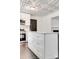 This bright kitchen features a white island with gold hardware and marble flooring at 1423 Ebinport Rd, Rock Hill, SC 29732