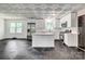 Updated kitchen features white cabinets, stainless steel appliances, and stylish black and white flooring at 1423 Ebinport Rd, Rock Hill, SC 29732