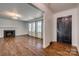 Spacious living room featuring hardwood floors, fireplace and natural light from large windows at 1423 Ebinport Rd, Rock Hill, SC 29732