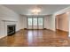 Bright living room with hardwood floors, fireplace, and large windows offering plenty of light at 1423 Ebinport Rd, Rock Hill, SC 29732