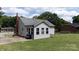 Home with an expansive lawn and a fenced-in backyard with mature trees at 1423 N New Hope Rd, Gastonia, NC 28054