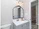 Bright bathroom with a vanity, modern fixtures and a unique mirror at 1423 N New Hope Rd, Gastonia, NC 28054