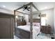 Spacious bedroom featuring a four-poster bed, dresser, and soft lighting for a relaxing ambiance at 1423 N New Hope Rd, Gastonia, NC 28054