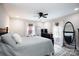 A bedroom with hardwood floors, a black ceiling fan, and large windows, creating a serene and inviting space at 1423 N New Hope Rd, Gastonia, NC 28054
