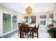 Cozy dining room with modern lighting, table and chairs, and slider door access at 1423 N New Hope Rd, Gastonia, NC 28054