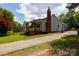 Lovely single-story home with brick chimney, inviting front porch, and driveway at 1423 N New Hope Rd, Gastonia, NC 28054