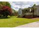 Attractive home with charming front porch, lush lawn, and mature landscaping at 1423 N New Hope Rd, Gastonia, NC 28054