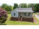 Charming home with a brick foundation, inviting front porch, and a lush green lawn at 1423 N New Hope Rd, Gastonia, NC 28054