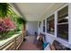 A quaint, furnished front porch offers a comfortable and inviting outdoor space at 1423 N New Hope Rd, Gastonia, NC 28054