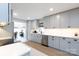 Modern kitchen featuring a neutral color palette, stainless steel appliances, and quartz countertops at 1423 N New Hope Rd, Gastonia, NC 28054