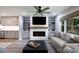 Inviting living room featuring a modern fireplace and stylish built-in shelving at 1423 N New Hope Rd, Gastonia, NC 28054