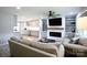 Spacious living room featuring a cozy sofa and an entertainment center at 1423 N New Hope Rd, Gastonia, NC 28054