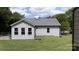 The back of the home reveals a fenced-in yard, and well-maintained siding at 1423 N New Hope Rd, Gastonia, NC 28054