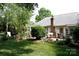 Spacious backyard featuring a patio, garden, and mature trees, creating a private outdoor oasis at 14406 Gadwall Ct, Charlotte, NC 28273