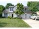 Charming two-story home featuring a manicured lawn, mature landscaping, and a two-car garage with a vintage pickup truck at 14406 Gadwall Ct, Charlotte, NC 28273