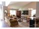 Inviting living room featuring comfortable seating, hardwood floors, and an entertainment center with natural light at 14406 Gadwall Ct, Charlotte, NC 28273