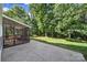 This expansive backyard features a patio, lush lawn, and mature trees, perfect for outdoor activities at 1506 Ivy Bluff Way, Matthews, NC 28105