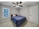 Comfortable bedroom with neutral walls, carpet, and a window providing natural light at 1506 Ivy Bluff Way, Matthews, NC 28105