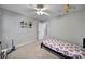 Well-lit bedroom featuring carpet, a ceiling fan, and neutral walls at 1506 Ivy Bluff Way, Matthews, NC 28105