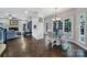 Bright dining area featuring hardwood floors and lots of natural light at 1506 Ivy Bluff Way, Matthews, NC 28105