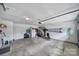 This garage has ample space, including storage shelves and room for a work area at 1506 Ivy Bluff Way, Matthews, NC 28105