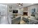 Inviting living room featuring a brick fireplace, plush couches, and modern decor, perfect for relaxing and entertaining at 1506 Ivy Bluff Way, Matthews, NC 28105