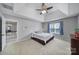 Spacious main bedroom featuring neutral walls, carpet, and a window providing ample natural light at 1506 Ivy Bluff Way, Matthews, NC 28105