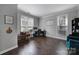 Bright office space with hardwood floors, a desk, and abundant natural light is perfect for remote work at 1506 Ivy Bluff Way, Matthews, NC 28105