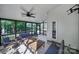 This screened-in patio provides a relaxing view of the yard with comfortable seating at 1506 Ivy Bluff Way, Matthews, NC 28105
