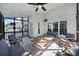 This covered patio has light colored furniture and offers a comfortable spot to relax and entertain at 1506 Ivy Bluff Way, Matthews, NC 28105