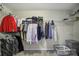 Walk-in closet with shelving and hanging rods for ample storage of clothes and accessories at 1506 Ivy Bluff Way, Matthews, NC 28105