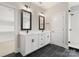 Spacious bathroom with a double vanity, modern fixtures, and a glass-enclosed shower for a luxurious feel at 1513 Landis Ave, Charlotte, NC 28205