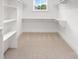 Walk-in closet features built-in shelving and ample storage space, providing a functional and organized area at 1513 Landis Ave, Charlotte, NC 28205
