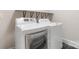 Well-equipped laundry room featuring a modern washer and dryer unit with storage shelf at 1513 Landis Ave, Charlotte, NC 28205