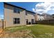 Home exterior with a patio, grill, and well-maintained lawn at 159 Saye Pl, Mooresville, NC 28115