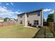 Enjoy outdoor living in this backyard with a patio, grill, and fenced yard at 159 Saye Pl, Mooresville, NC 28115