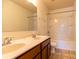 Bathroom features a double sink vanity and a shower-tub combo at 159 Saye Pl, Mooresville, NC 28115
