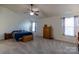 Primary bedroom suite featuring large windows, neutral carpet, ceiling fan and decorative furnishings at 159 Saye Pl, Mooresville, NC 28115